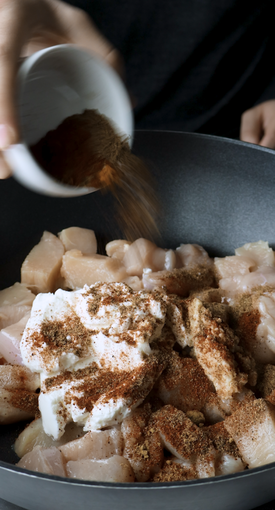 greek yogurt and garlic and spices in chicken